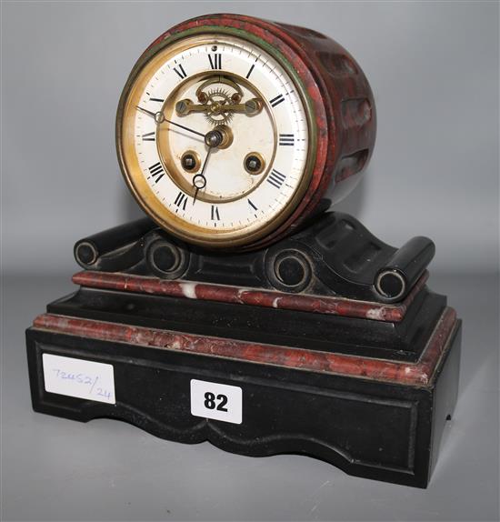 A marble and black slate clock
